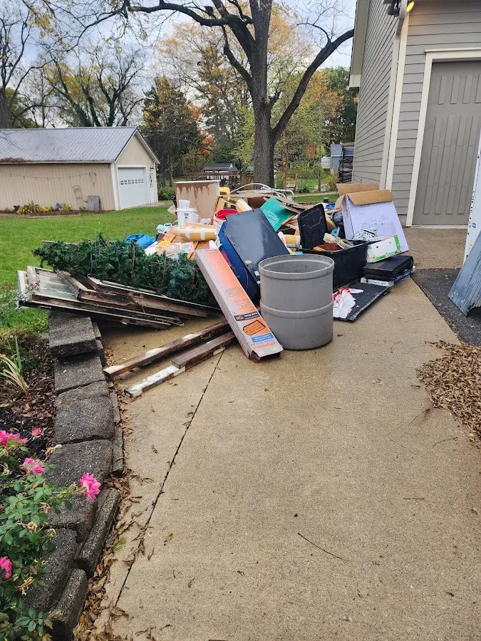 Dumpster being loaded with debris for 30 Yard Dumpster Rental in Prospect Park